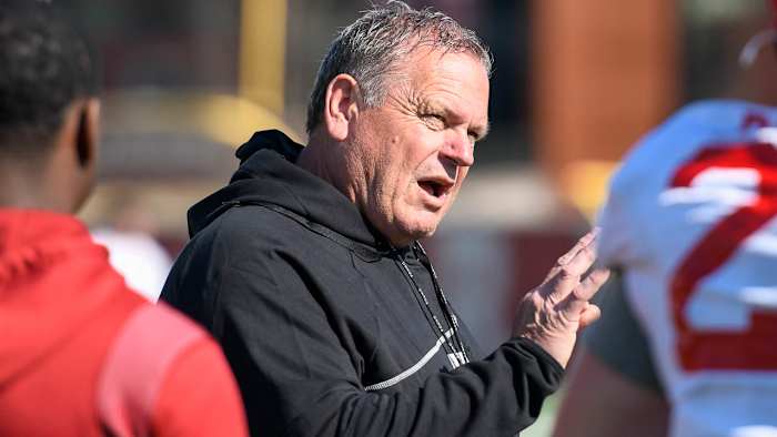 Razorbacks coach Sam Pittman talking to running backs during Tuesday afternoon's practice.
